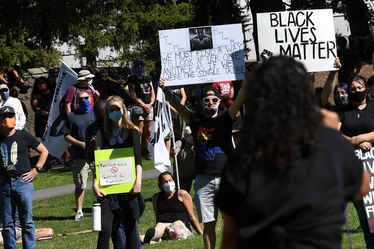 Natasha Hill speaks to a large crowd during a Black Lives Matter protest and march on Sunday, August 30, 2020, in Spokane, Wash.  (Tyler Tjomsland/THE SPOKESMAN-REVIEW)