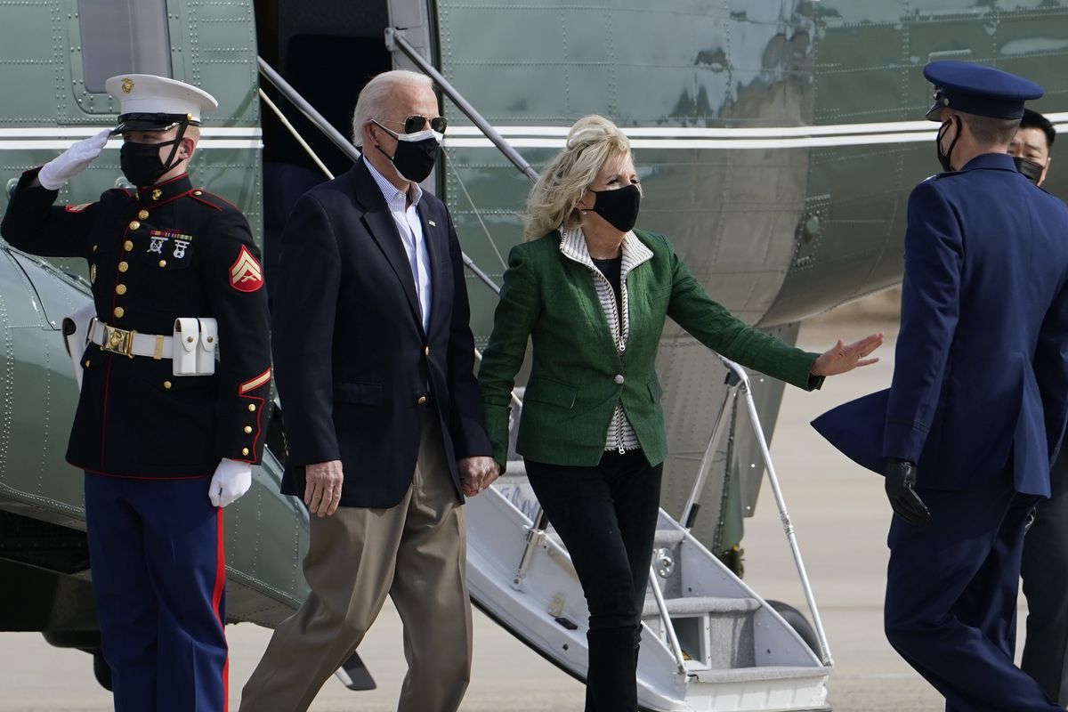 President Joe Biden and first lady Jill Biden are greeted as they walk from Marine One towards Air Force One at Andrews Air Force Base, Md., Friday, Feb. 26, 2021. They are en route to Houston to survey damage caused by severe winter weather and encourage people to get their coronavirus shots.  (Susan Walsh)