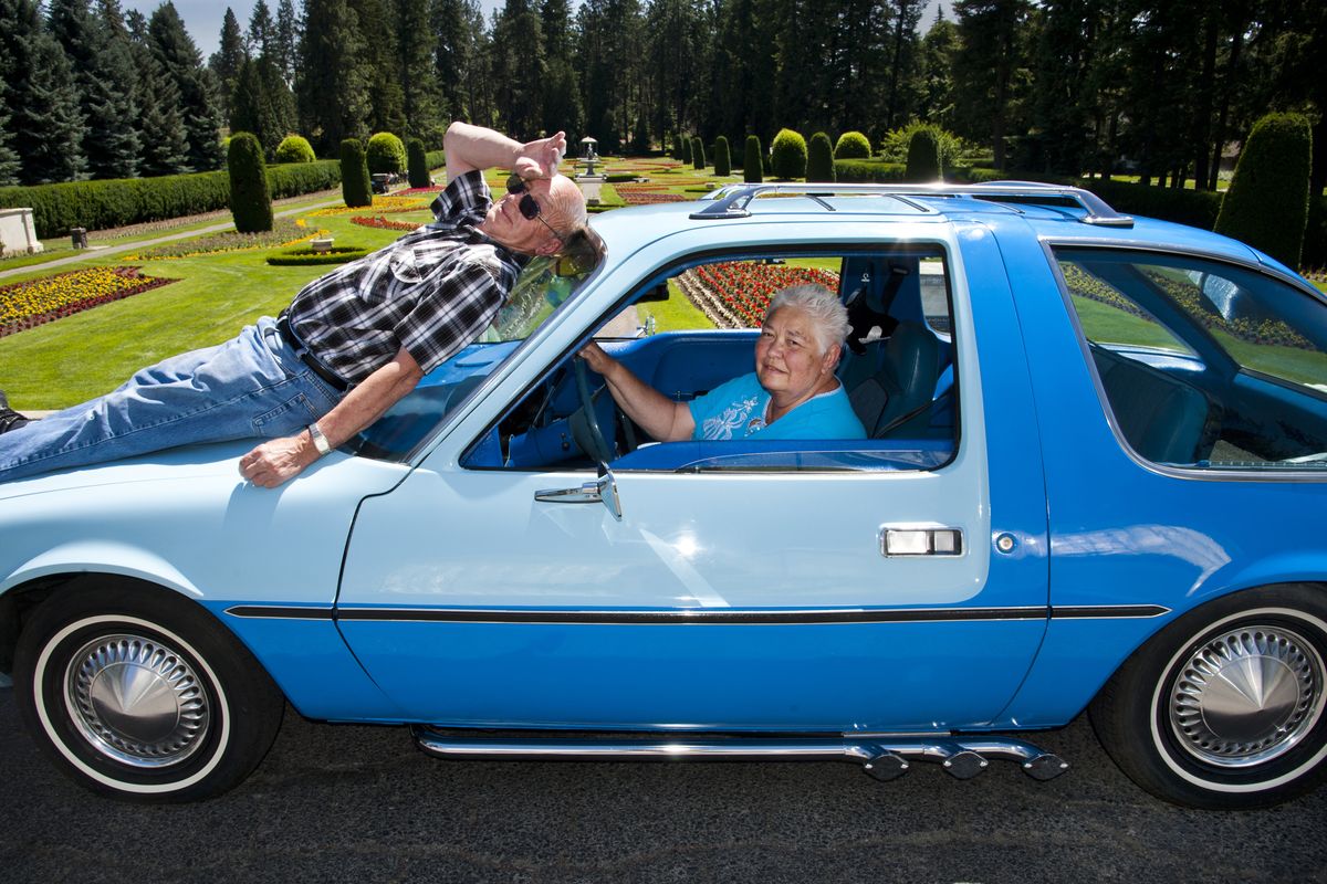 Dick Dodd can use a break from the attention his 1975 AMC Pacer receives when driving around the Spokane area. His wife, Dody, is at the wheel. (Dan Pelle)