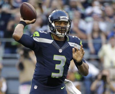Seattle Seahawks quarterback Russell Wilson threw for 192 yards and two touchdowns. (Elaine Thompson / Associated Press)