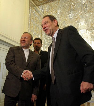 
EU foreign policy chief Javier Solana, right, shakes hands with Iranian Foreign Minister, Manouchehr Mottaki, at the conclusion of their meeting in Tehran, Iran, on Tuesday.
 (Associated Press / The Spokesman-Review)