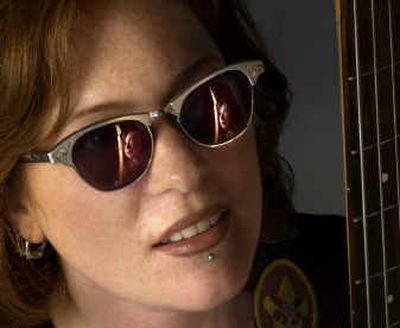 
Char Getchell is reflected in the sunglasses of her bandmate Val Nygaard. The duo and drummer Christopher Mervar (not pictured) make up the band Ctrl Z. 
 (Amanda Smith / The Spokesman-Review)