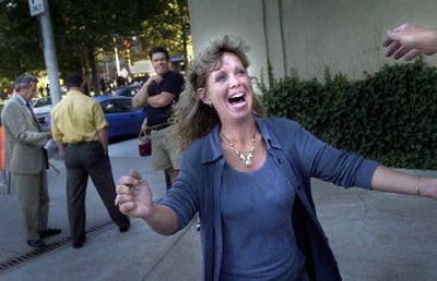 
Shannon Sullivan greets a supporter outside Spokane City Hall on Thursday before the start of the official recall campaign to oust Mayor Jim West. 
 (Brian Plonka / The Spokesman-Review)