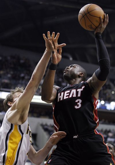 Miami guard Dwyane Wade fires away for 31 first-half points. (Associated Press)