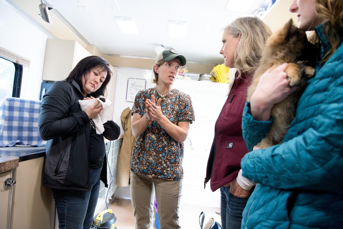 Dr. Laura Talaga speaks with Glenna Mace , left, with Pawsitive Outreach Spay/Neuter Alliance (POSNA), Cheri Scandals, right, with Higher Ground Animal Sanctuary, and Catlin Knight, far right, with Path of Hope Rescue, in Talaga
