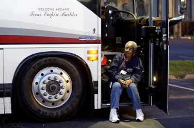 
Hurricane Katrina evacuee Rose J. Anderson, 72, waits to board a bus in Houston on Monday to travel to Lake Charles, La., to cast an early vote in the New Orleans mayoral race. 
 (Associated Press / The Spokesman-Review)