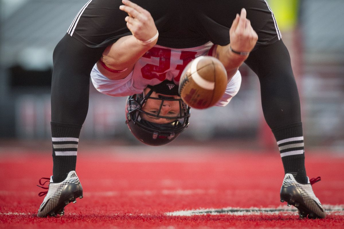 Eastern Washington long snapper Cory Alcantar sees his football world upside down, but he straightened out the difficulties he had as a youth in Southern California. (Colin Mulvany)