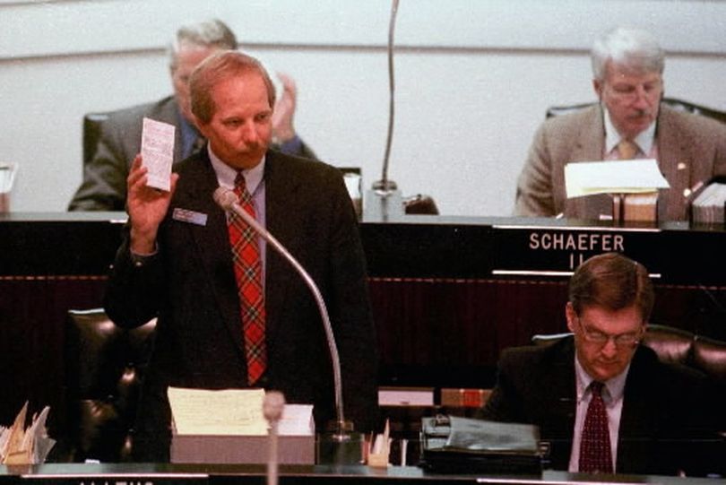 North Idaho representative Jeff Alltus waves a copy of the U.S. constitution during a 1998 debate on the floor of the Idaho House of Representatives. (Jesse Tinsley/SR file photo)