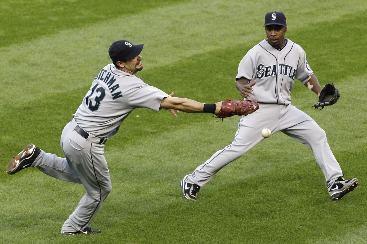Seattle first baseman Casey Kotchman, left, is unable to catch a blooper by Chicago White Sox