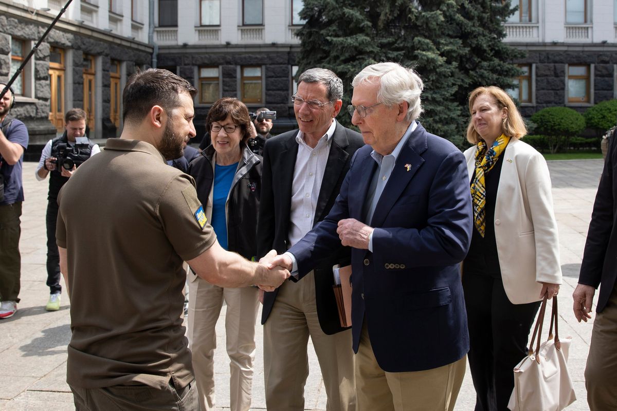 In this handout photo provided by the Ukrainian Presidential Press Office, Ukrainian President Volodymyr Zelenskyy, left, shakes hands with Senate Minority Leader Mitch McConnell, R-Ky., in Kyiv, Ukraine, Saturday, May 14, 2022.  (HOGP)
