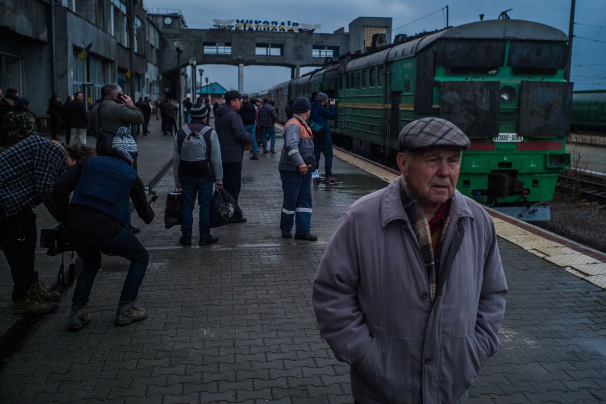 The first train to liberated Kherson from Kyiv arrives in Mykolaiv, Ukraine, on Saturday. After an interruption of nearly nine months because of the Russian occupation, Ukrainian passenger rail services have been restored on the line.  (For The Washington Post)