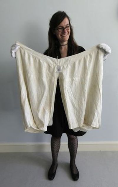 AP Photo/Lefteris Pitarakis
Alexandra Kim, curator of the Royal Ceremonial Dress Collection, holds a pair of bloomers which once belonged to Britain's Queen Victoria, as she poses for the photographer at Kensington Palace, in central London, Tuesday. The underwear, which has a 56-inch (142-centimeter) waist, has been added to Britain's Royal Ceremonial Dress Collection at Kensington Palace. It has a matching chemise, is embroidered with a 
