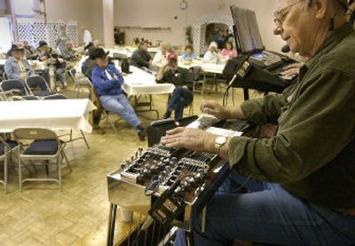 
Darrell Klein plays his steel guitar at a benefit performance earlier this year in Coeur d'Alene.
 (Jesse Tinsley / The Spokesman-Review)