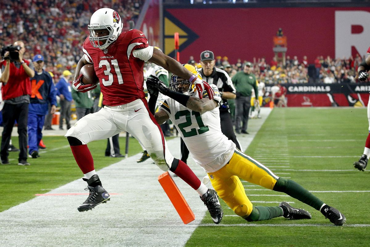Arizona Cardinals running back David Johnson (31) scores a touchdown as Green Bay Packers free safety Ha Ha Clinton-Dix (21) defends during the second half of an NFL football game, Sunday, Dec. 27, 2015, in Glendale, Ariz. (Ross Franklin / Associated Press)