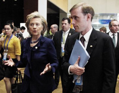 This Nov. 11, 2009 file photo shows then-Secretary of State Hillary Rodham Clinton walking with a then-Deputy Chief of Staff Jake Sullivan in Singapore.  (Ng Guan / Associated Press)
