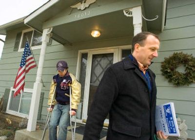 
Even though he's on crutches, Cody Thompson visited Colbert homes with his dad, Colin, encouraging people to vote for the Mead levy.
 (Christopher Anderson / The Spokesman-Review)