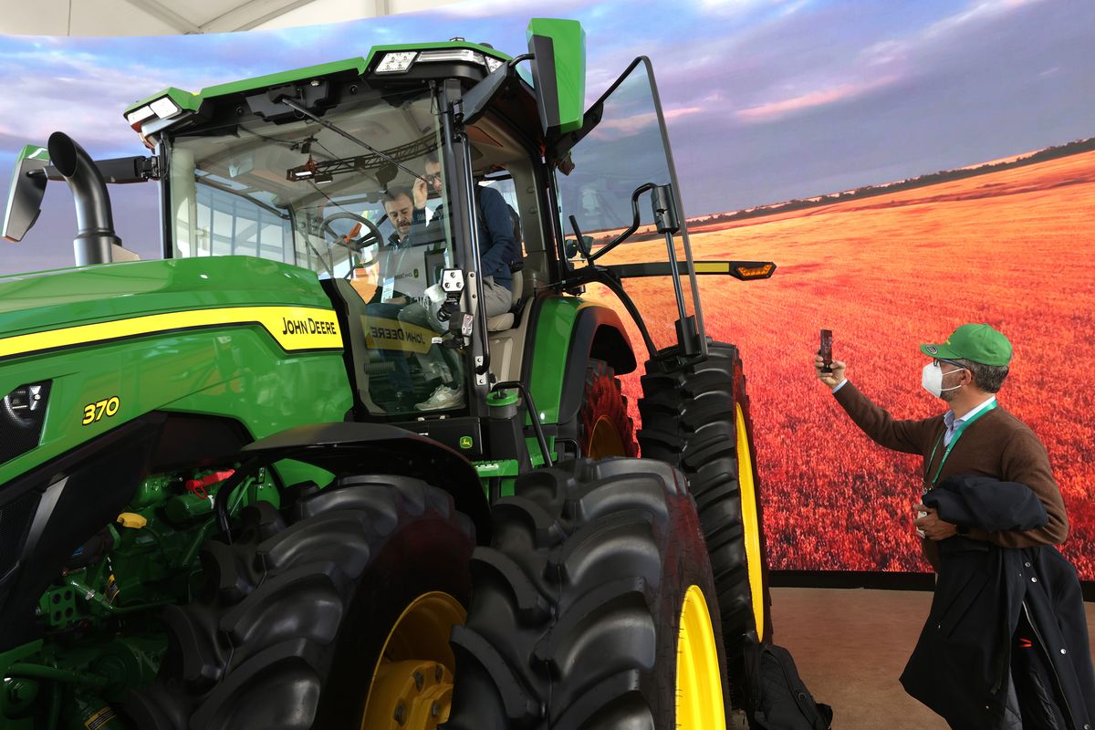 The John Deere 8R autonomous tractor is on display at the company booth at CES 2022 at the Las Vegas Convention Center on Jan. 6, 2022, in Las Vegas, Nevada. CES is the world’s largest annual consumer technology trade show.  (Alex Wong/Getty Images North America/TNS)