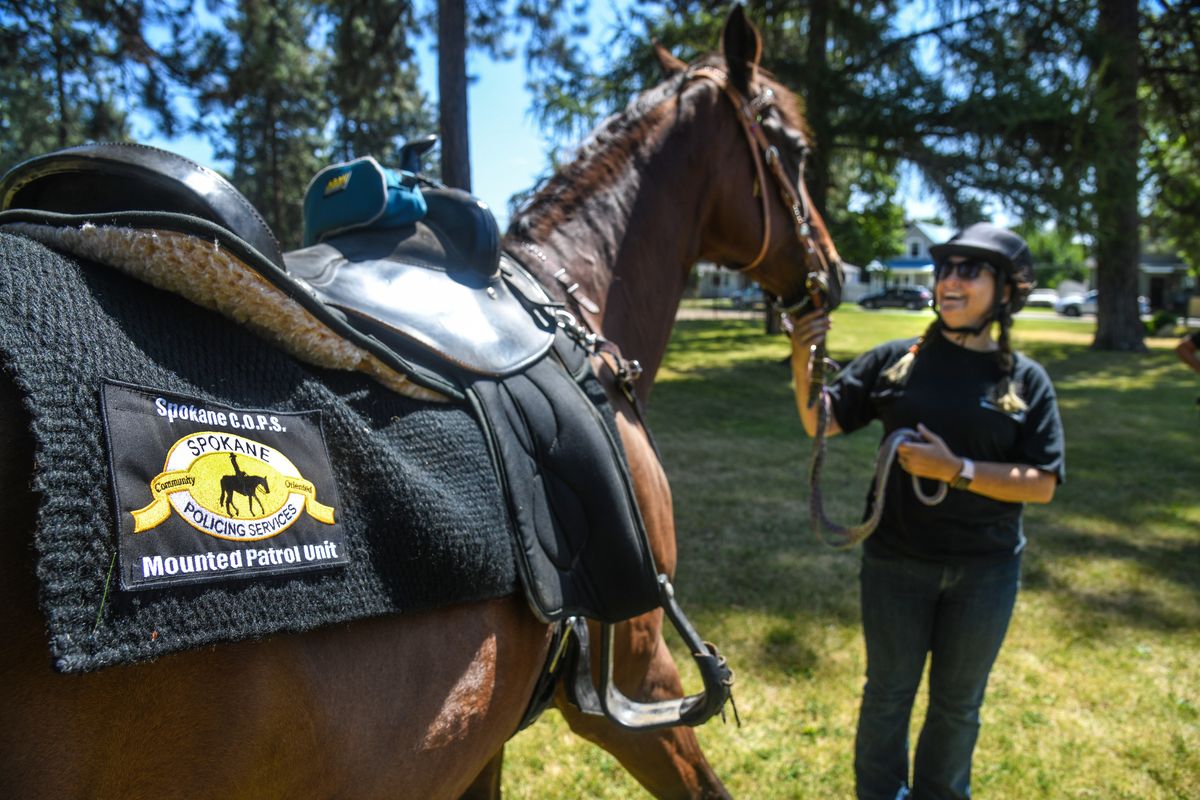 Spokane C.O.P.S. Mounted Patrol member Brandy Cusick visited Glass Park with Josie, Tuesday, Aug. 4, 2020, in Spokane.  (DAN PELLE/THE SPOKESMAN-REVIEW)