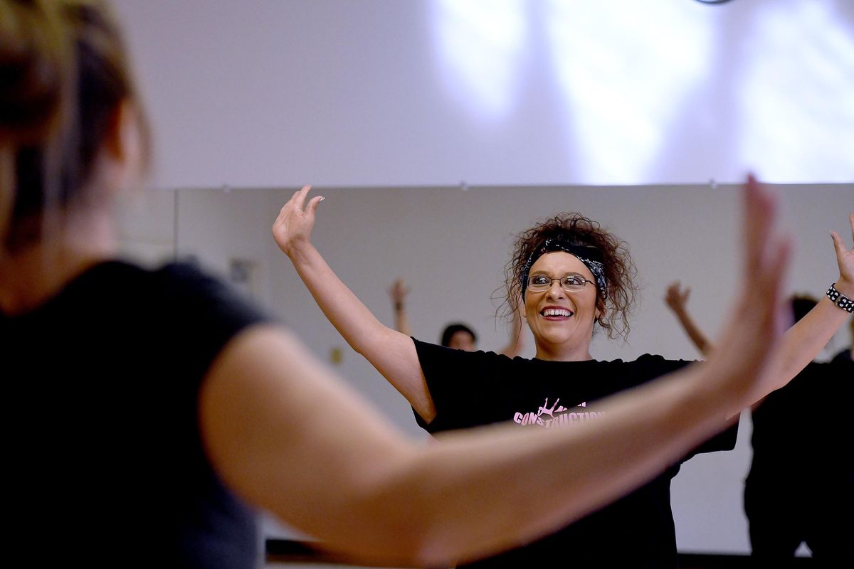 Cherylina Moore teaches a PiYo Aerobics class at The Hub in Spokane Valley on March 20. (Kathy Plonka / The Spokesman-Review)