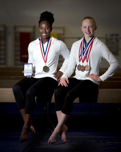 Gymnasts McKenzie Jones, 18, left, and Gina Twenge, 13, medalled at the Level 9 Western National competition that encompasses all 24 states west of the Mississippi. (Colin Mulvany / The Spokesman-Review)