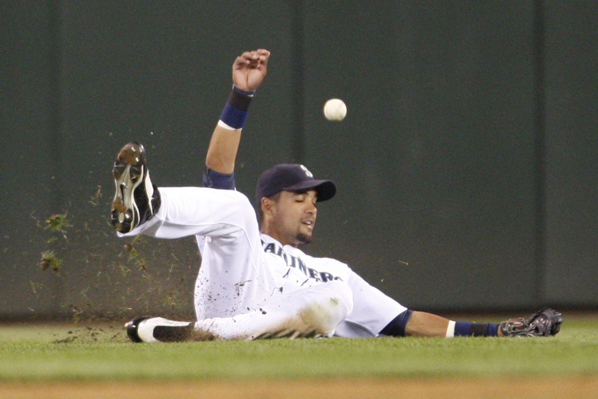 M’s Franklin Gutierrez missed the catch on this ball hit by Nelson Cruz for a double. (Associated Press)