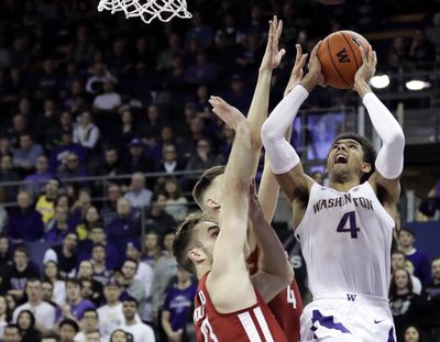 Washington guard Matisse Thybulle (4) shoots against Washington State forwards Jeff Pollard, left, and Aljaz Kunc, second from left, during the first half of an NCAA college basketball game, Saturday, Jan. 5, 2019, in Seattle. (Ted S. Warren / AP)