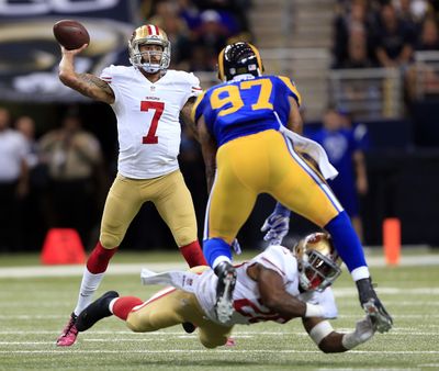 Colin Kaepernick rallied the 49ers from an early 14-0 deficit, throwing for 343 yards and three touchdowns in a 31-17 win over the Rams. (Associated Press)