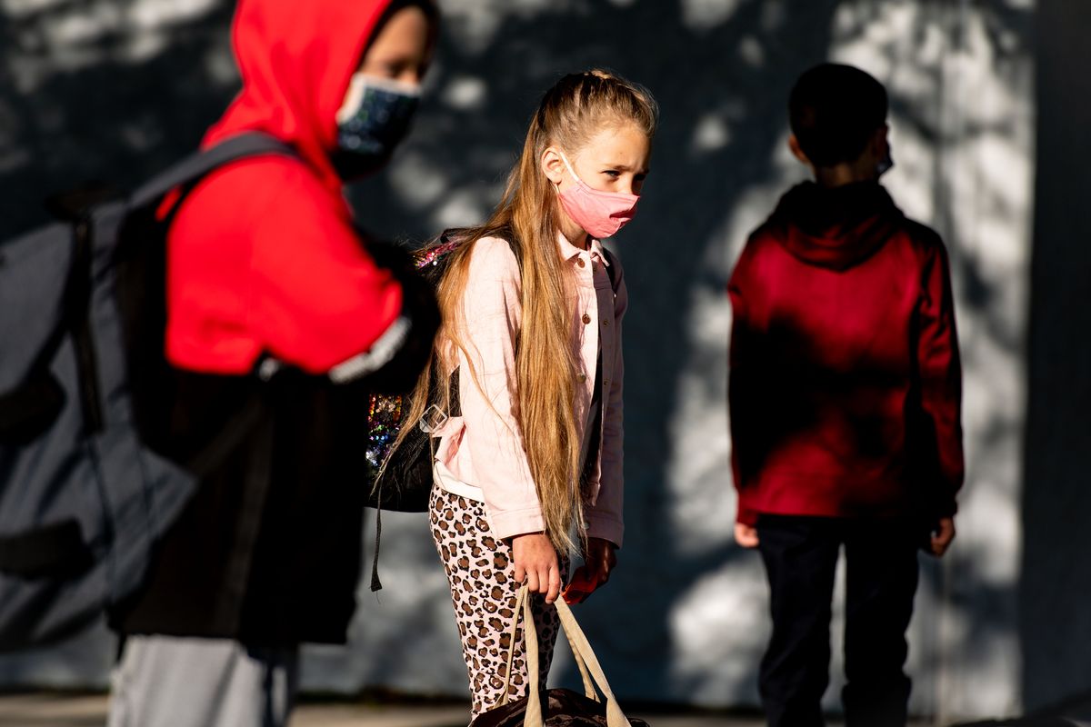 Arcadia Elementary School third grader Aleah Burton, 8, social distances from classmates as she lines up outside the building on the first day of school on Tuesday in Deer Park.  (Colin Mulvany/THE SPOKESMAN-REVIEW)