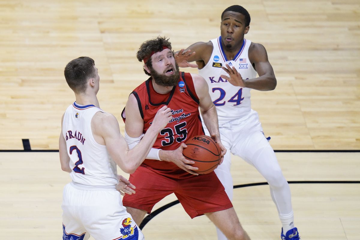 Eastern Washington forward Tanner Groves (35) is pressured by Kansas guard Christian Braun (2) and Kansas guard Bryce Thompson (24) as he goes up for a shot during the second half of a first-round game in the NCAA college basketball tournament at Farmers Coliseum in Indianapolis, Saturday, March 20, 2021.  (Associated Press)