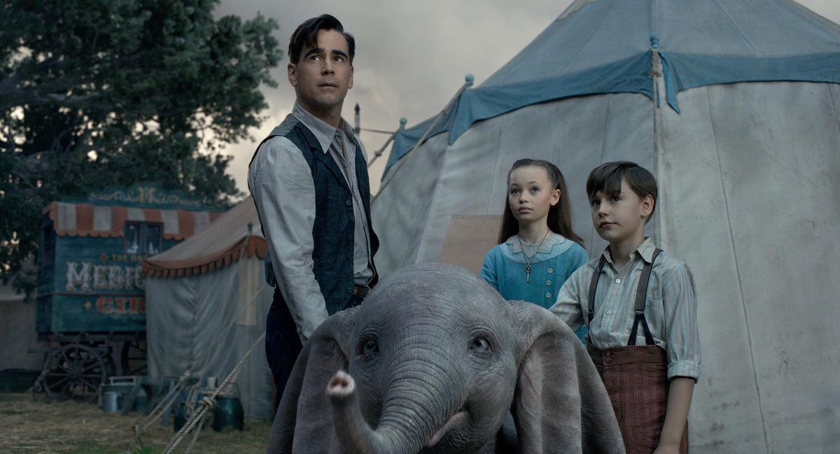 Colin Farrell, Nico Parker and Finley Hobbins star as a family who takes care of the baby elephant in “Dumbo.” In this remake, none of the animals utter a word. (Walt Disney Pictures / Walt Disney Pictures)