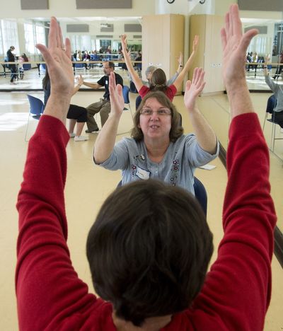 Shirley Hernandez, who has a nerve disorder called essential tremors, stretches during a special dance class for Parkinson’s disease patients run by the dance department at Gonzaga University. “It helps my movement, my mind and it helps me have fun,” said Hernandez. (Colin Mulvany)