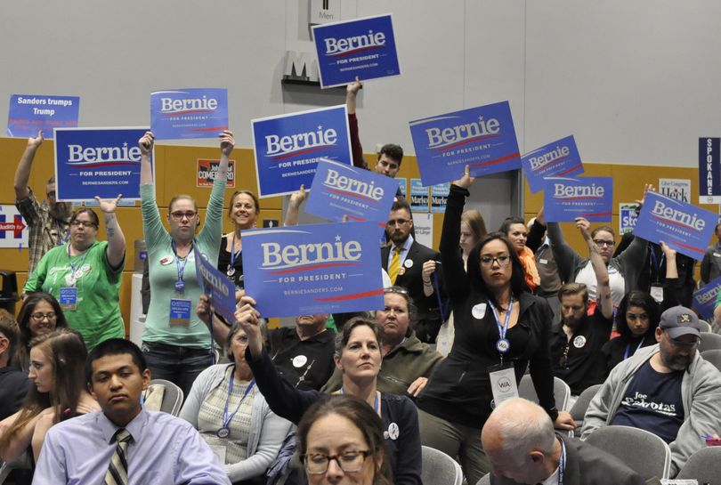 TACOMA -- Bernie Sanders delegates in the Spokane County delegation to the Washington Democratic Convention show support for a resolution to endorse Sanders for president. (Jim Camden/The Spokesman-Review)