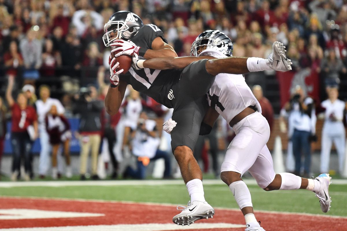 Washington State Cougars wide receiver Dezmon Patmon (12) hauls in a touchdown pass against Oregon Ducks cornerback Thomas Graham Jr. (4) late in the fourth quarter of a college football game on Saturday, October 20, 2018, at Martin Stadium in Pullman, Wash. WSU won the game 34-20. (Tyler Tjomsland / The Spokesman-Review)