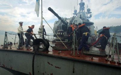 
The Russian navy ship Razliv's crew cast off during the sub rescue in the harbor of Petropavlovsk-Kamchatskky, Kamchatka. 
 (Associated Press / The Spokesman-Review)