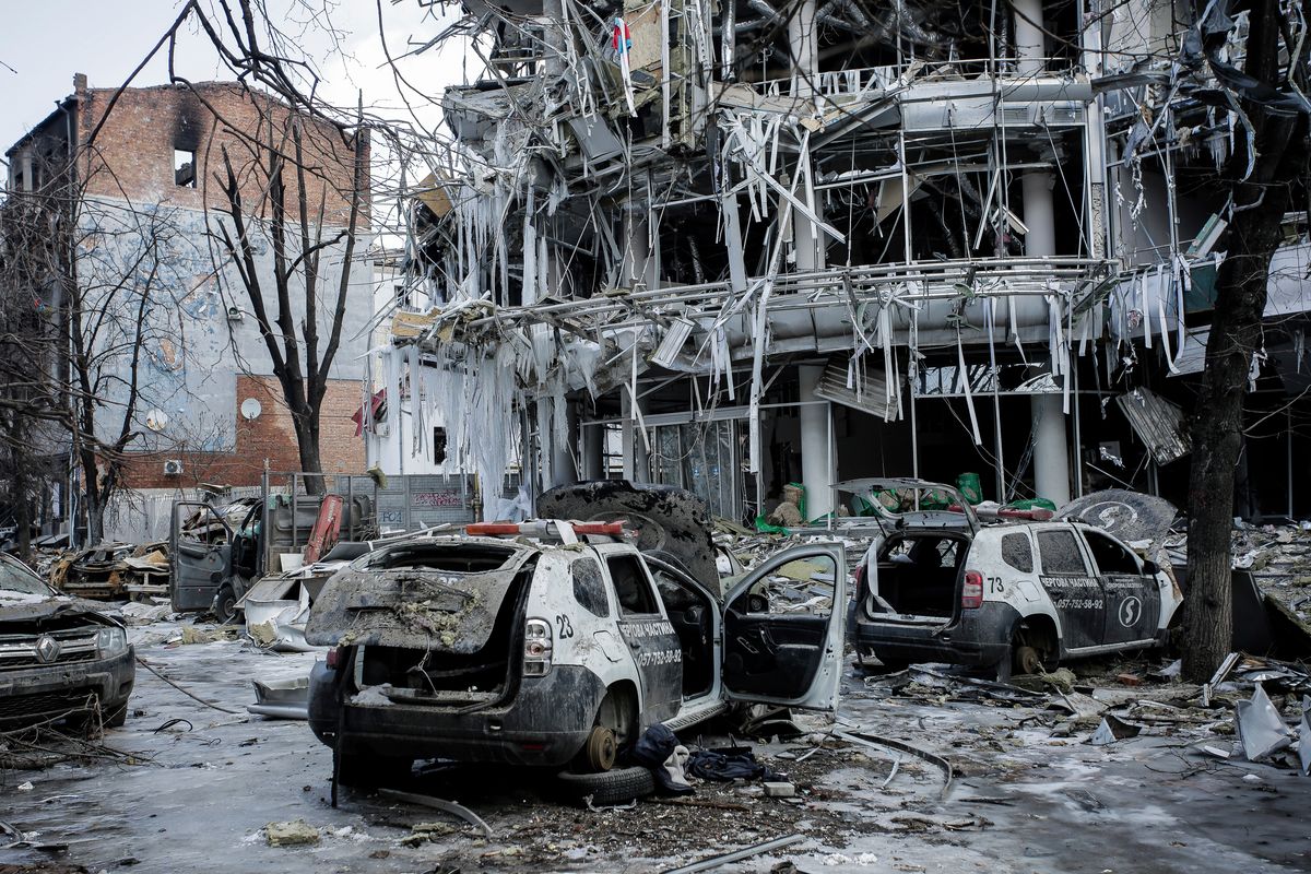 Damaged vehicles and buildings in Kharkiv, Ukraine, on Wednesday. Both Russia and Ukraine projected optimism ahead of another scheduled round of talks even as Moscow’s forces rained fire on Kyiv and other cities in a bid to crush the resistance that has frustrated Kremlin hopes for a lightning victory.  (Pavel Dorogoy)