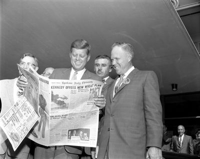 Sen. John F. Kennedy, Democratic nominee for president, looks at a Spokane Daily Chronicle on Sept. 6, 1960, during his campaign visit to Spokane.  (Spokesman-Review archives)