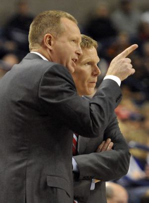 Gonzaga assistant Ray Giacoletti, left, puts his head together with head coach Mark Few. Giacoletti has accepted the head coaching position at Drake. (Jesse Tinsley)
