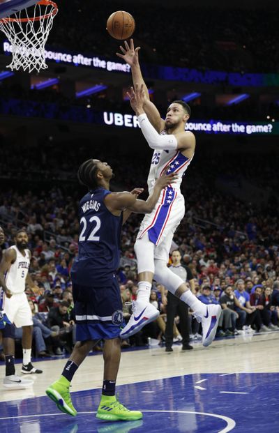 Philadelphia 76ers’ Ben Simmons shoots over Minnesota Timberwolves’ Andrew Wiggins during the second half of an NBA basketball game Saturday, March 24, 2018, in Philadelphia. The 76ers won 120-108. (Chris Szagola / Associated Press)