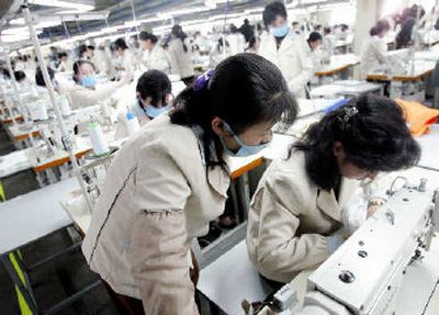 
North Korean female workers work at a factory of South Korean apparel maker Shinwon company in the inter-Korean industrial park in Kaesong. 
 (Associated Press / The Spokesman-Review)