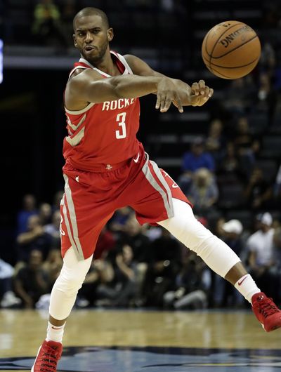 In this Oct. 11, 2017, photo, Houston Rockets guard Chris Paul (3) passes against the Memphis Grizzlies in the first half of an NBA preseason basketball game in Memphis, Tenn. (Rogelio V. Solis / Associated Press)