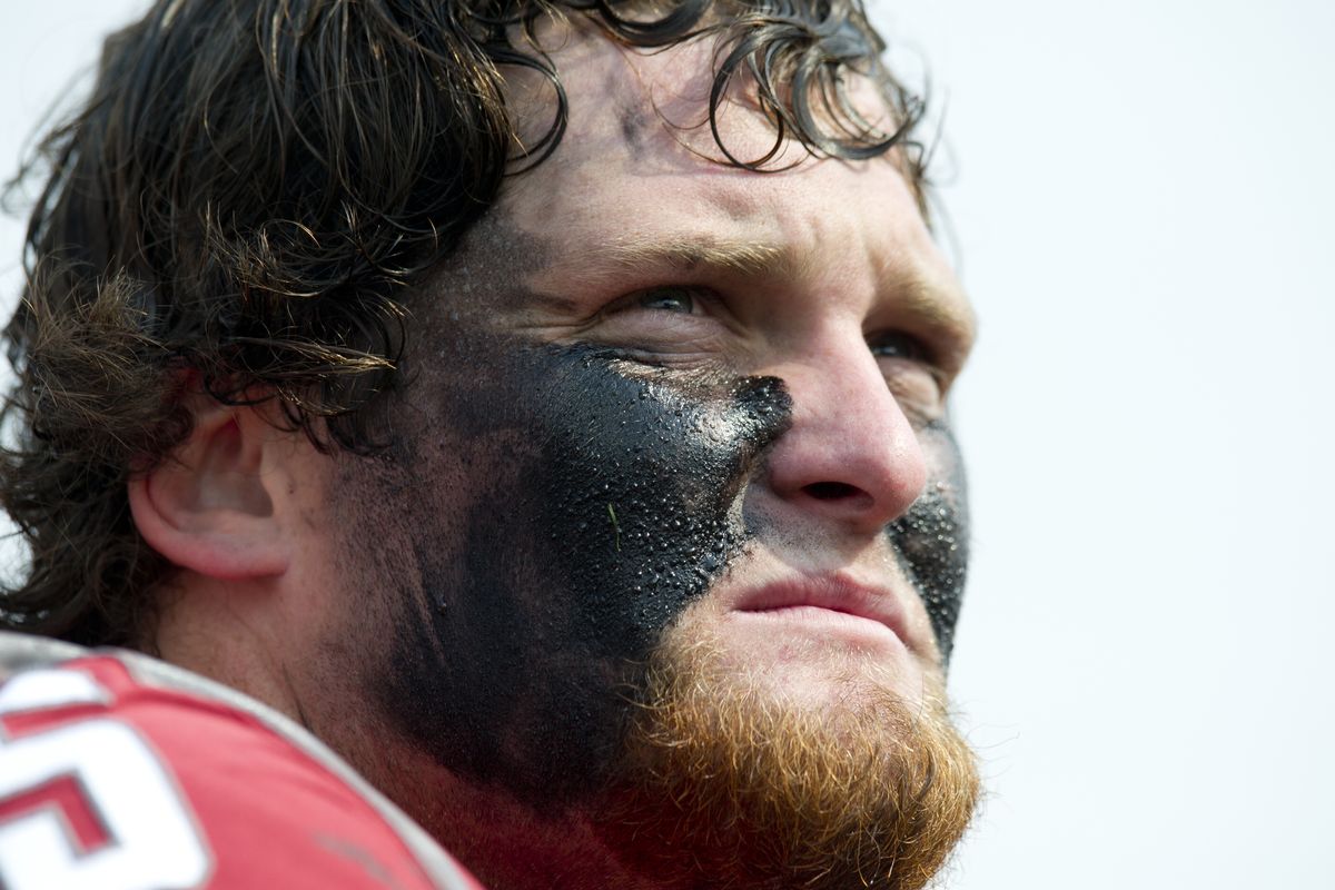 Right tackle Wade Jacobson watches from the sidelines in first half. (Tyler Tjomsland)