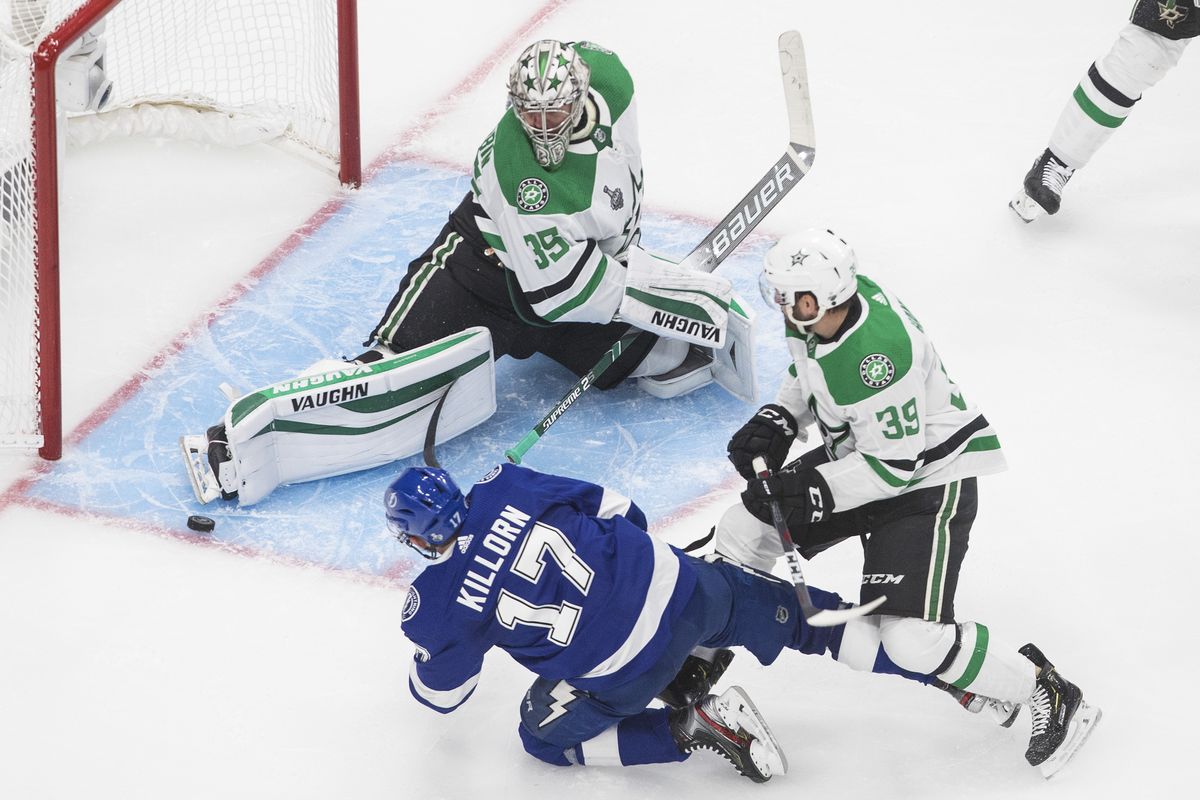 Dallas Stars goaltender Anton Khudobin (35) makes a save against Tampa Bay Lightning center Alex Killorn (17) as Dallas Stars defenseman Joel Hanley (39) defends during third-period NHL Stanley Cup finals hockey action in Edmonton, Alberta, Saturday, Sept. 19, 2020.  (Associated Press)