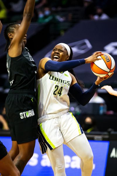 Seattle guard Jewell Loyd, left, fouls Dallas guard Arike Ogunbowale in the fourth quarter of a WNBA game, Sunday, June 6, 2021, in Everett. (Bettina Hansen/Seattle Times)