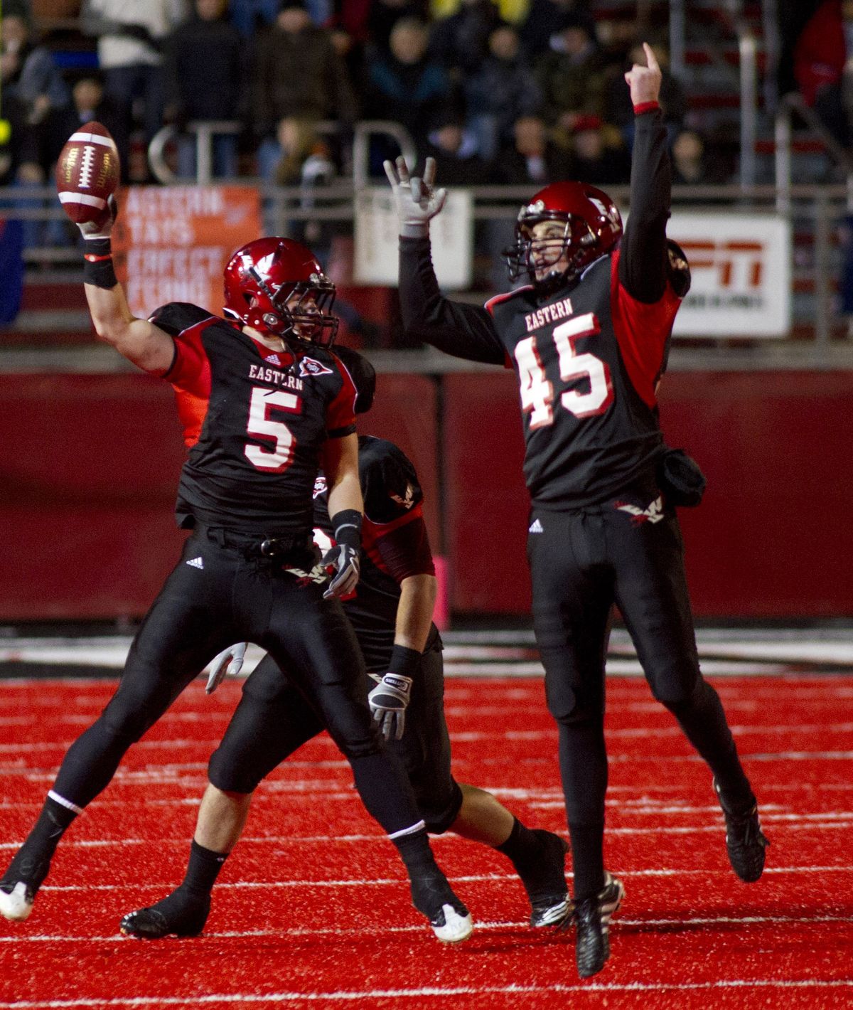 EWU's Matt Johnson (5) and Cameron Zuber  (45) celebrate a second quater fumble recovery on Friday, Dec. 17, 2010, during the NCAA Football Championship Subdivision Playoffs on Roos Field at the EWU campus in Cheney, Wash. (Colin Mulvany / The Spokesman-Review)