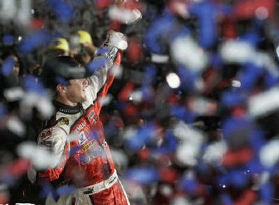 
NASCAR driver Kasey Kahne celebrates his win in the NASCAR Bank of America 500 auto race Saturday night. 
 (Associated Press / The Spokesman-Review)