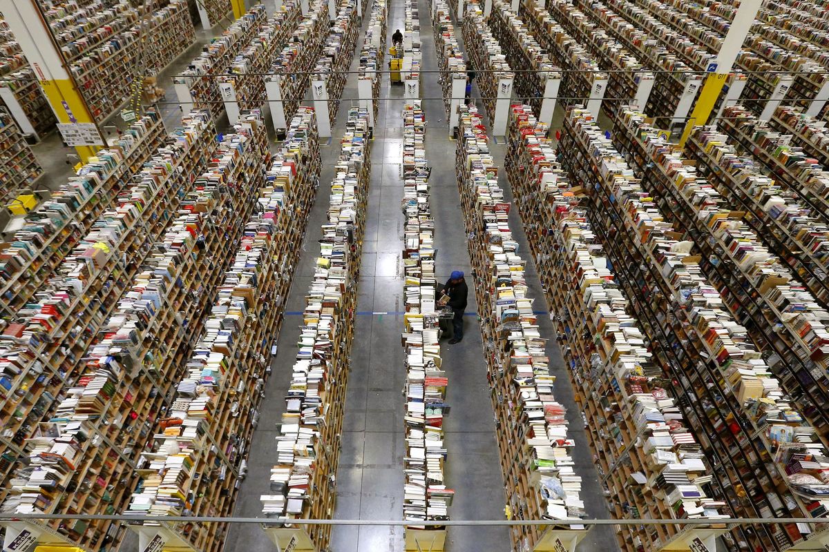An Amazon.com employee stocks products at an Amazon.com Fulfillment Center in Phoenix on Dec. 2, 2013. (Associated Press)