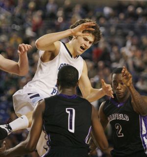 Gonzaga Prep's Chris Sarbaugh is stripped of the ball by Garfield defenders during late action at the 4A State Basketball Tournament Friday, March 4, 2011, in Tacoma, Wash. Gonzaga Prep won 66-53. Sarbaugh scored a game-high 24 points.  (Patrick Hagerty / Special to The Spokesman-Review)
