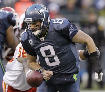 Kansas City’s Derrick Johnson knocks the ball loose from Seattle’s Matt Hasselbeck. The Chiefs recovered. (Associated Press)