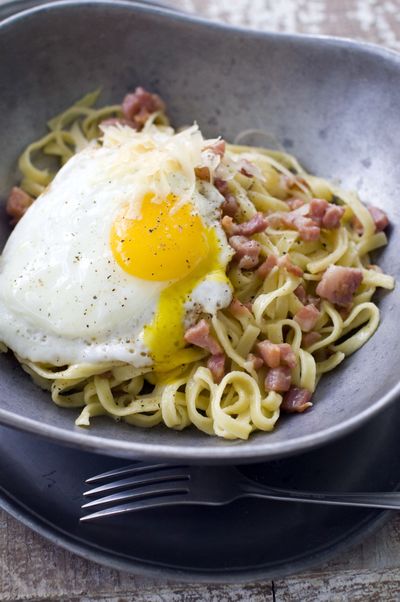 Whole Egg Pasta Carbonara, using only seven ingredients, varies from traditional carbonara by not incorporating the egg into the cheese “sauce” with which the pasta is tossed. (Associated Press)