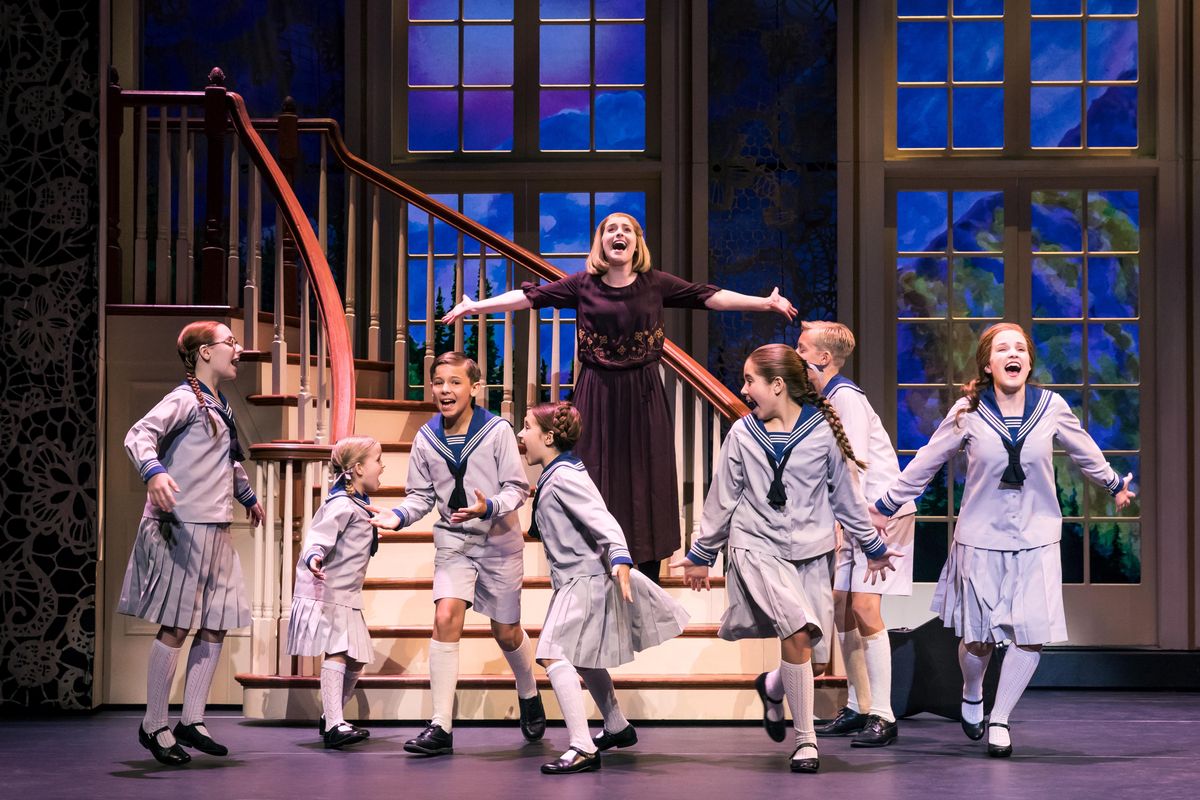 Jill-Christine Wiley as Maria Rainer and the von Trapp children in a scene from “The Sound of Music.” (Matthew Murphy)